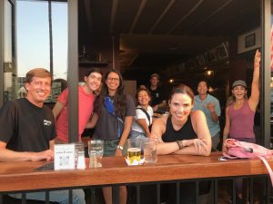 Photos of people looking into the camera, sitting indoor & outdoors at a pub
